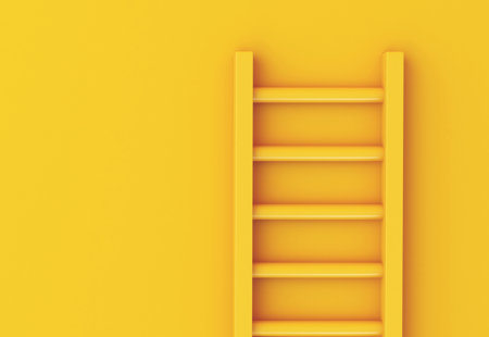 Photo of a yellow ladder leaning against a yellow wall