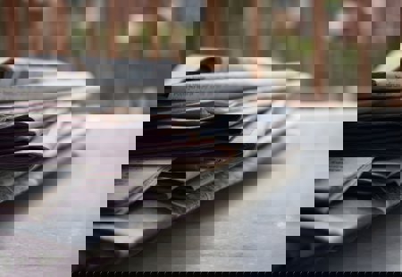 A stack of newspapers on a table