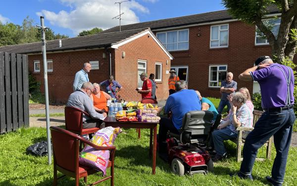 Customers at a community day of action event in Pennytown, Somercotes