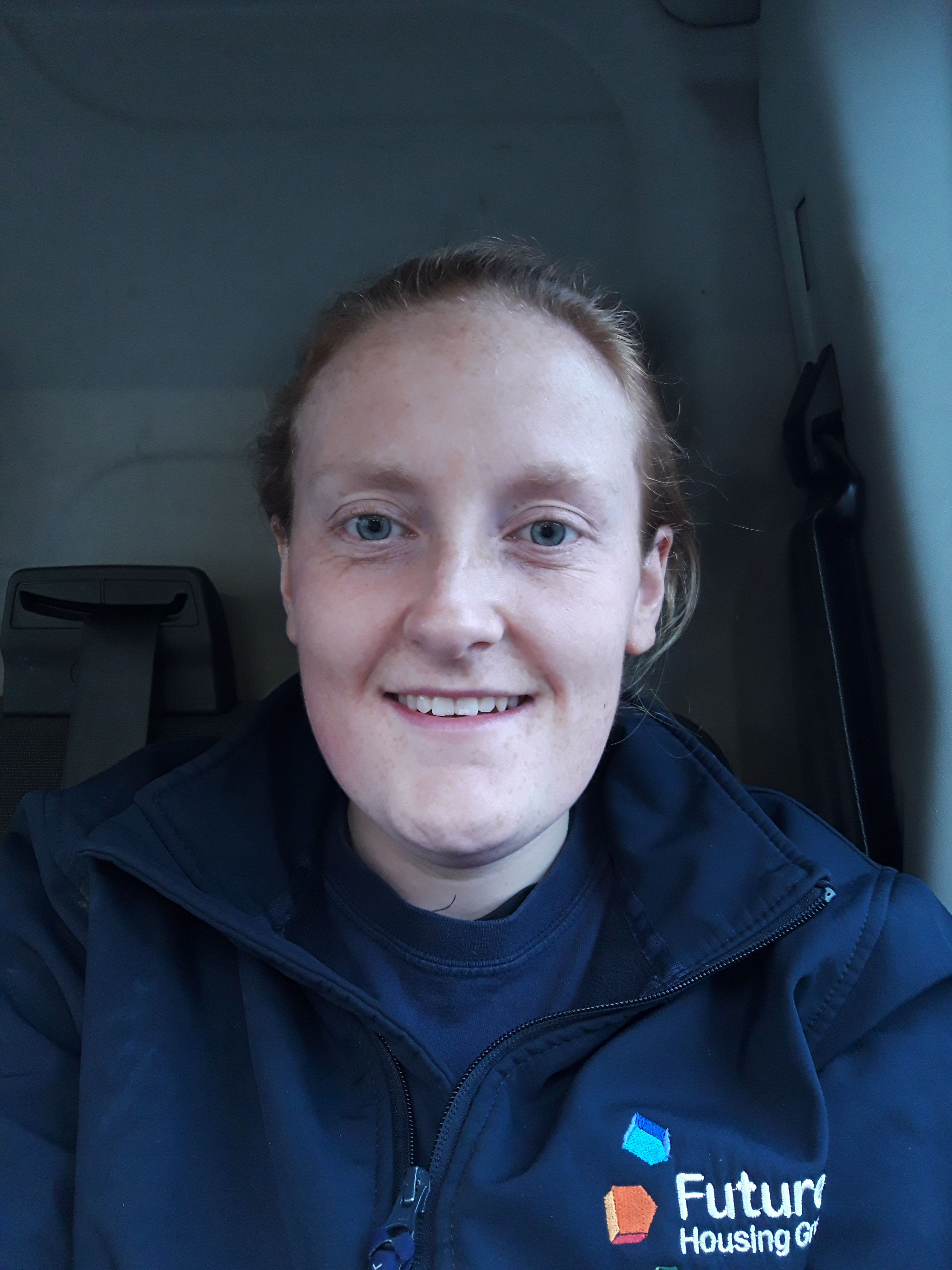 Bethany smiling to camera in a Futures Housing Group jacket