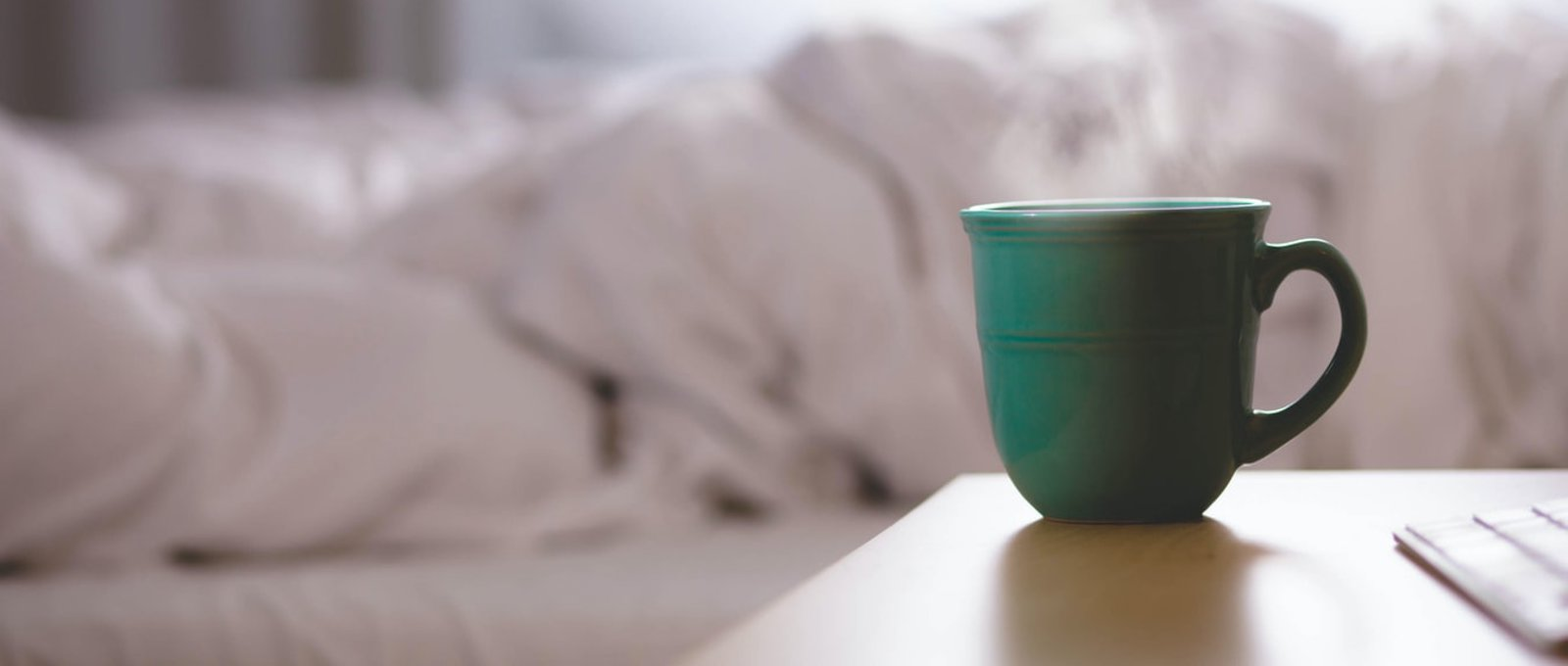 A steaming green mug