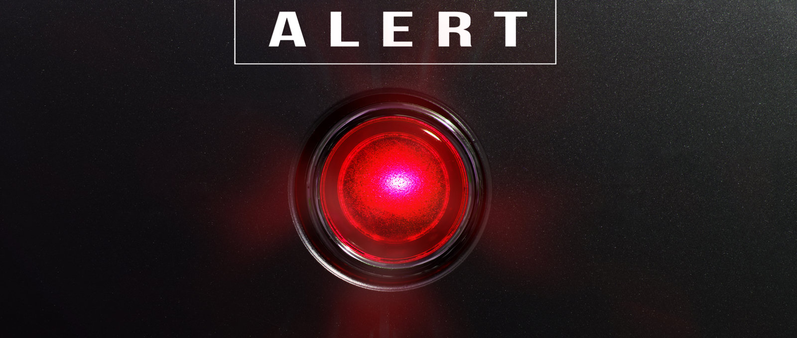 Photograph of a sinister glowing red light with the word 'alert' written above it