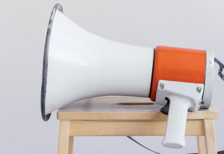 Photograph of a megaphone sitting on a stool