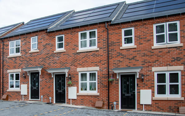Row of terraced homes with solar panels on