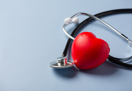 Stethoscope next to a red 3D love heart