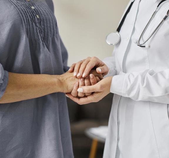 Covid Recovery Center Female Doctor Holding Older Patient S Hands