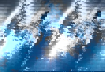 A bright blue sky with light cloud coverage