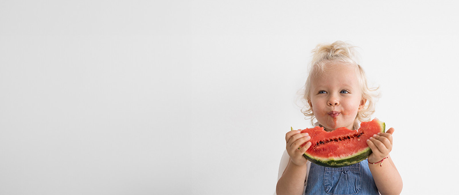 Little Girl Eating A Watermelon