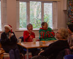 A community group in Christmas jumpers