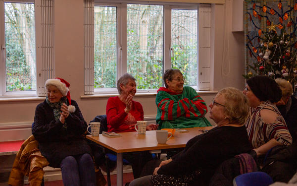 A community group in Christmas jumpers