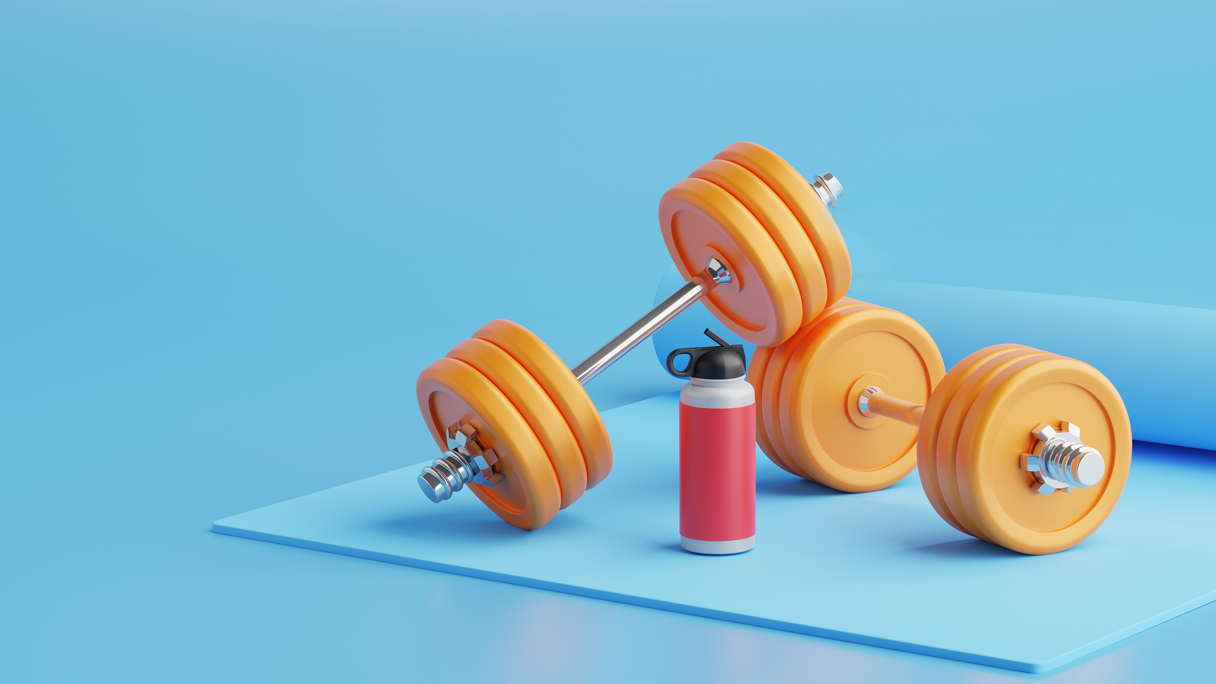 Photo of some exercise weights and a water bottle lying on a blue exercise mat against a blue background