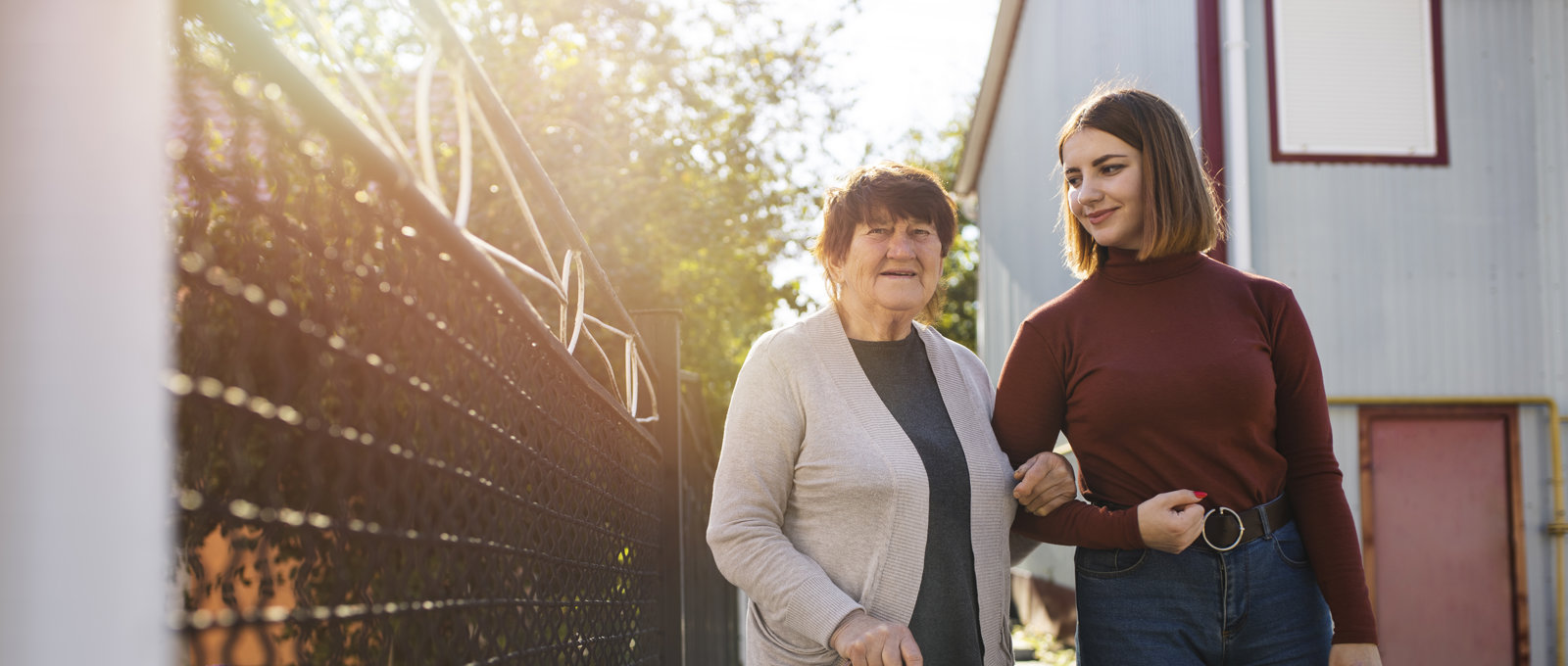 Person Helping Their Elder Neighbour