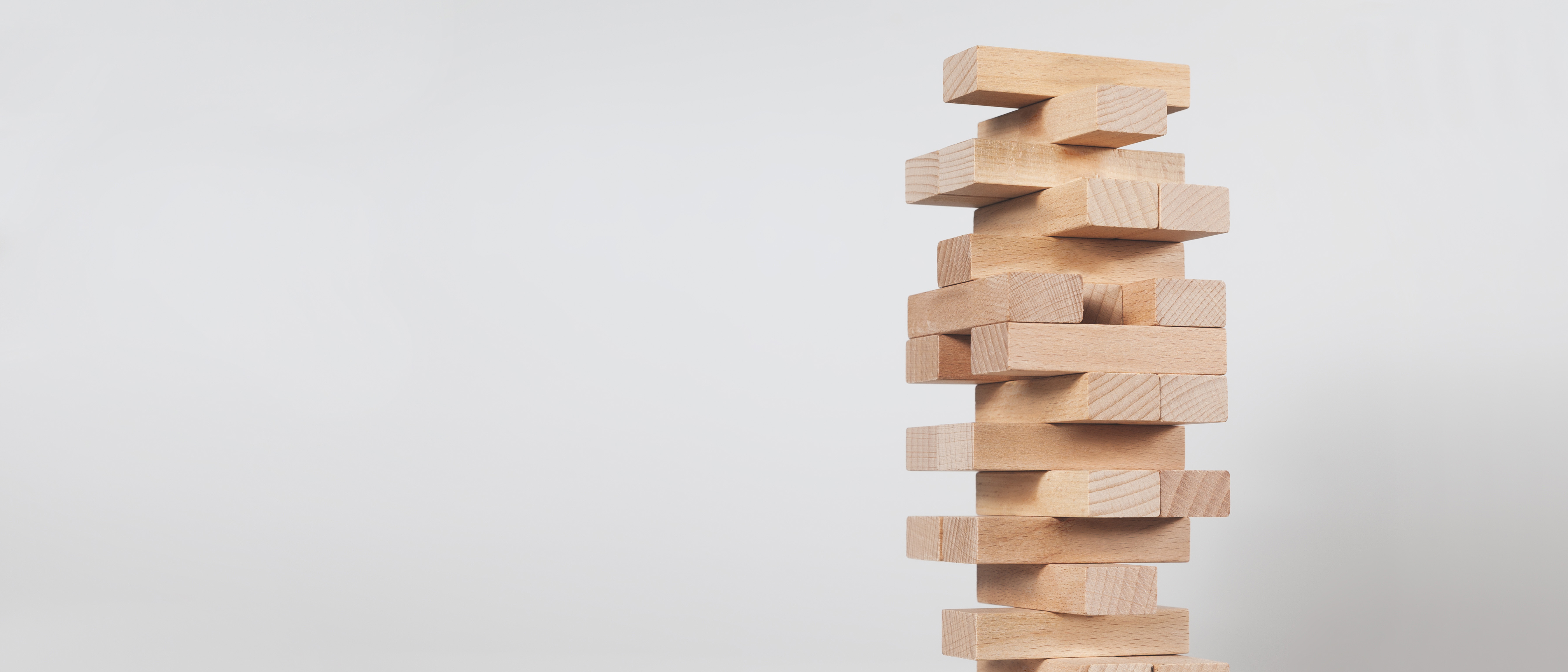 close-up of wooden blocks stacked for a game of jenga