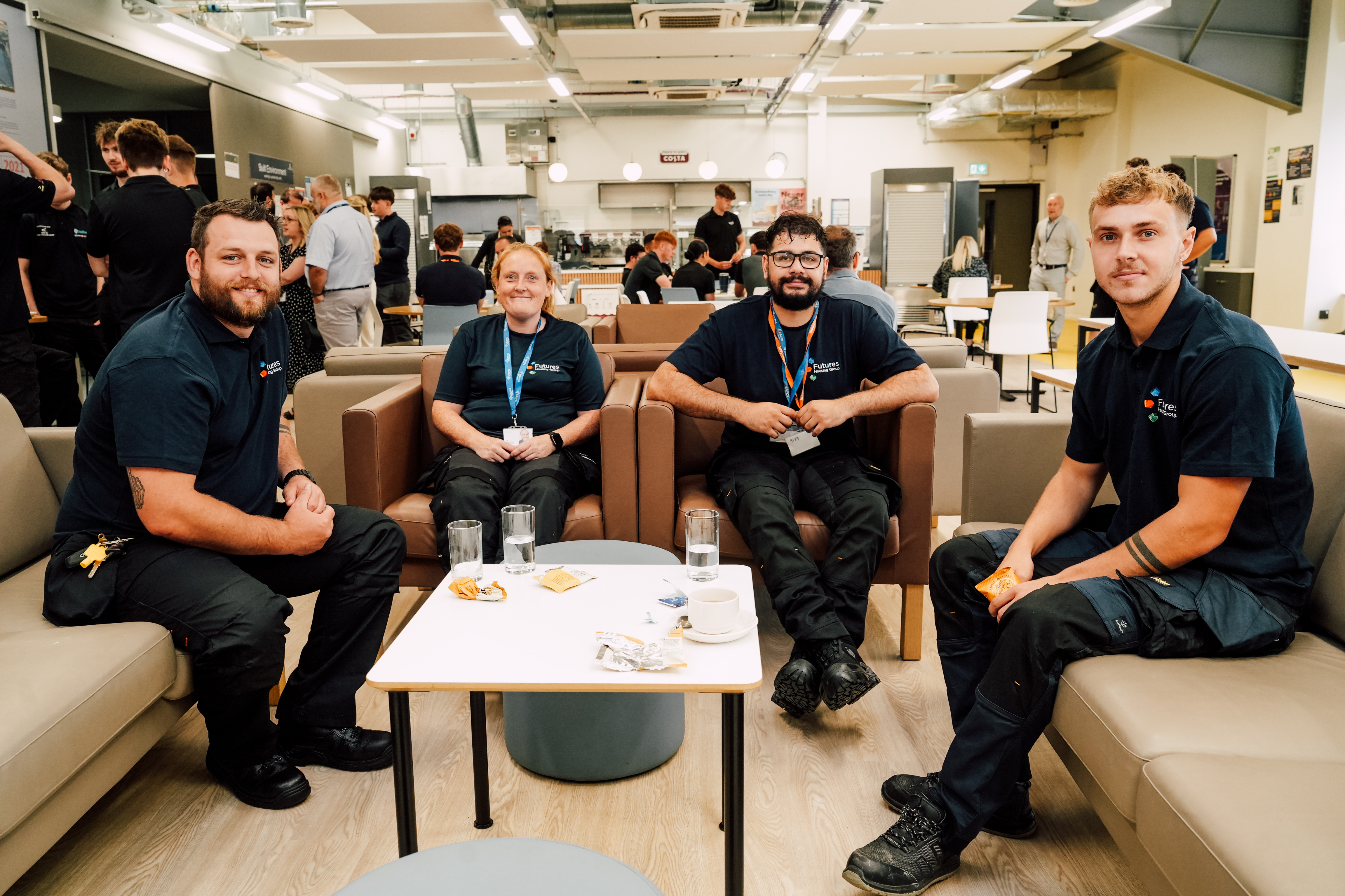 Futures colleagues in a group photo sat at a table