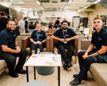 Futures colleagues in a group photo sat at a table