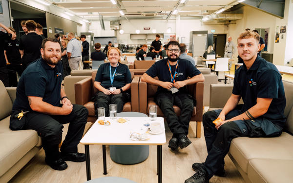 Futures colleagues in a group photo sat at a table