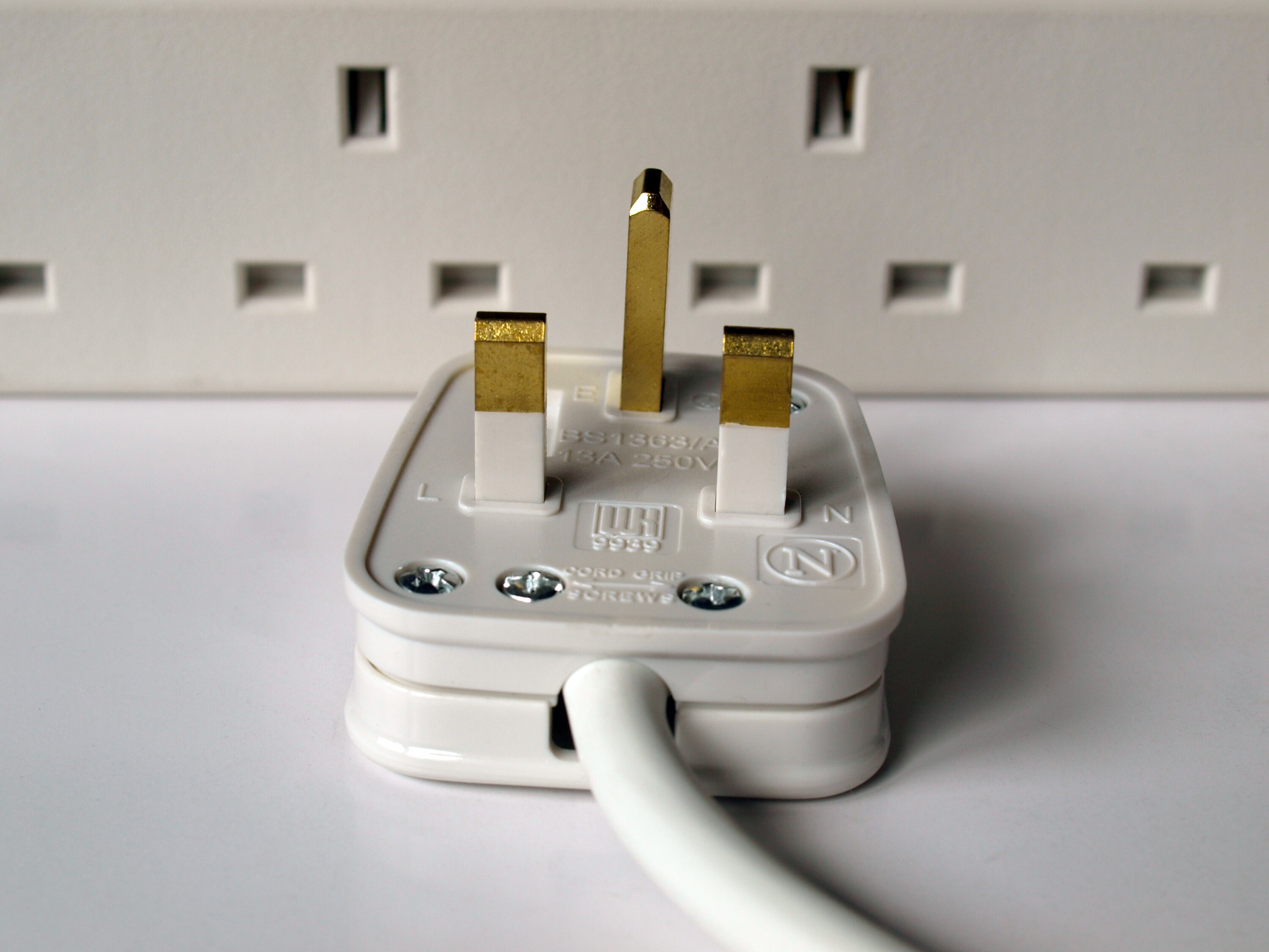 Plug with multi-socket adaptor behind it