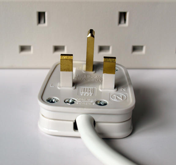 Plug with multi-socket adaptor behind it