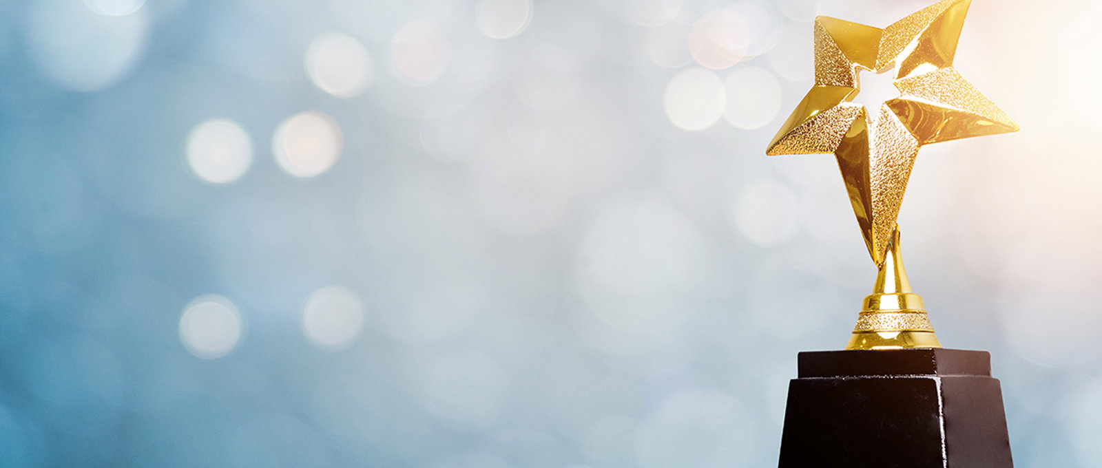 Gold Star Trophy With A Blue Background