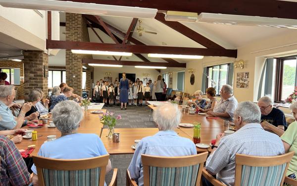 School choir performing for Warwick Court, Daventry customers 11