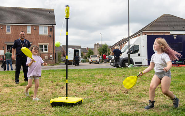 Children playing swingball at Langley Mill event