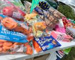 Loads of food, snacks and picnic items on a table