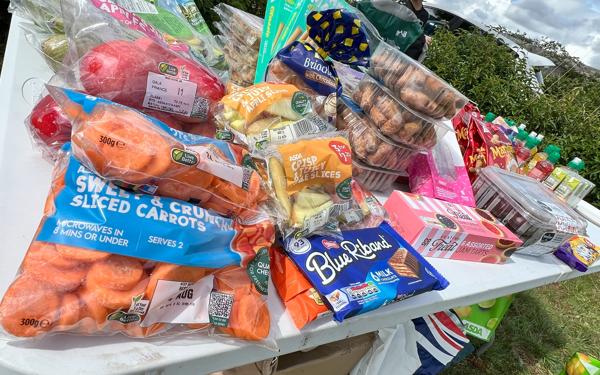 Loads of food, snacks and picnic items on a table