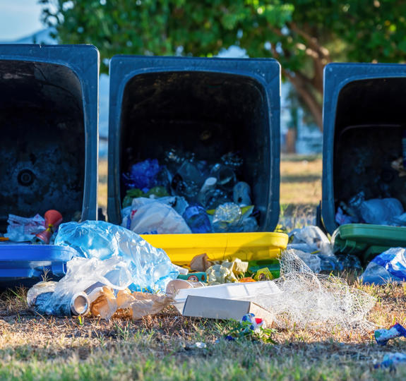Dropped Dumpsters With Fallen Out Trash Ground