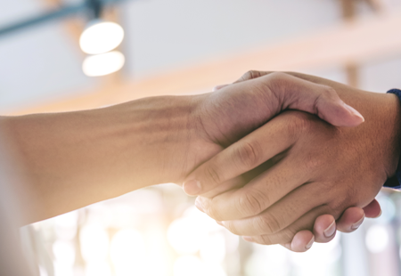 Two People Shaking Hands