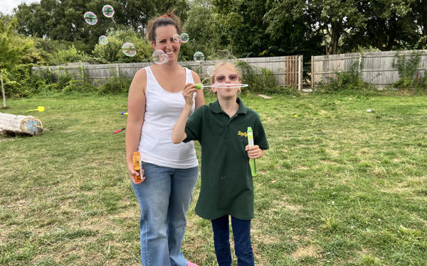 Adult And Child With Bubbles (1)