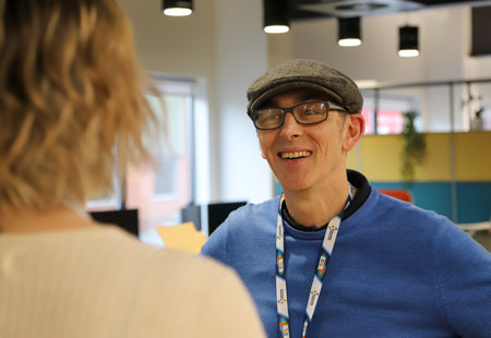 Mick talks to a colleague at Futures House.