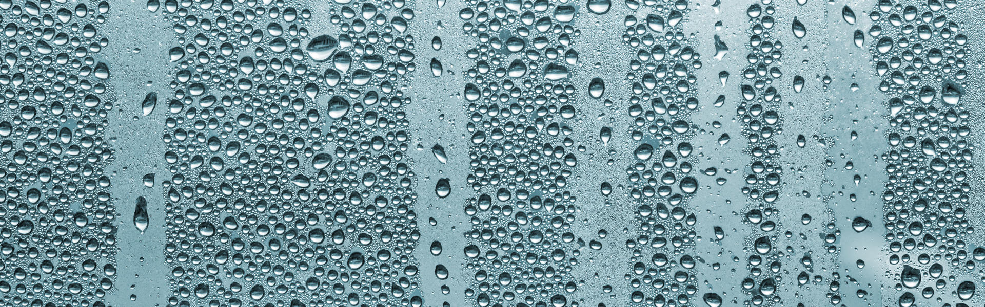 Close up of heavy condensation on a window