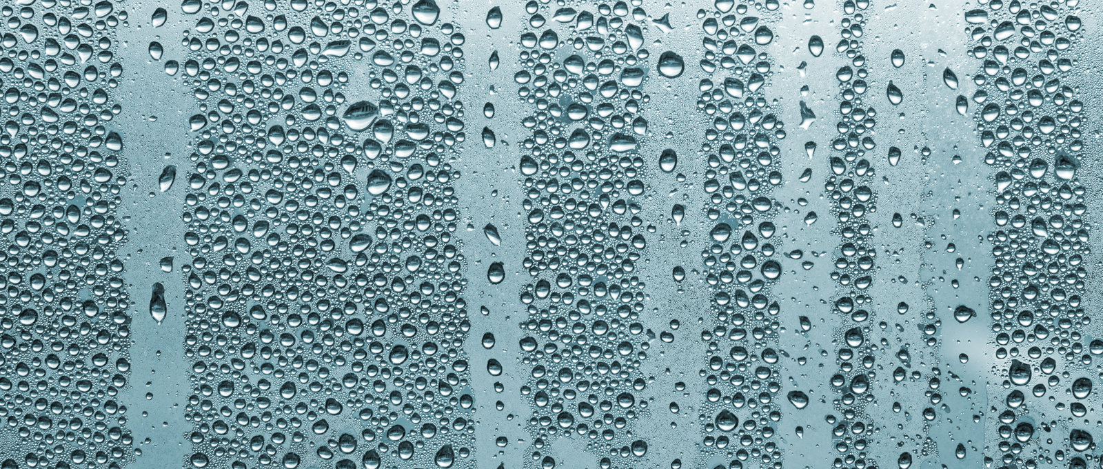 Close up of heavy condensation on a window