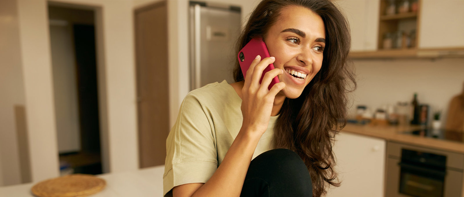Woman On Phone In Kitchen Banner