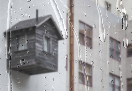 White Apartment Through Window With Rain Drops