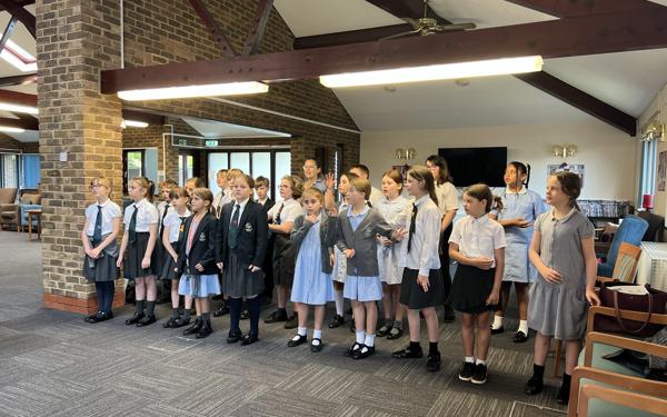School choir performing for Warwick Court, Daventry customers