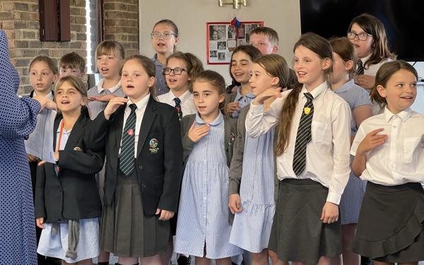 School choir performing for Warwick Court, Daventry customers 10
