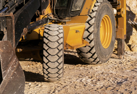 Excavator digging ground