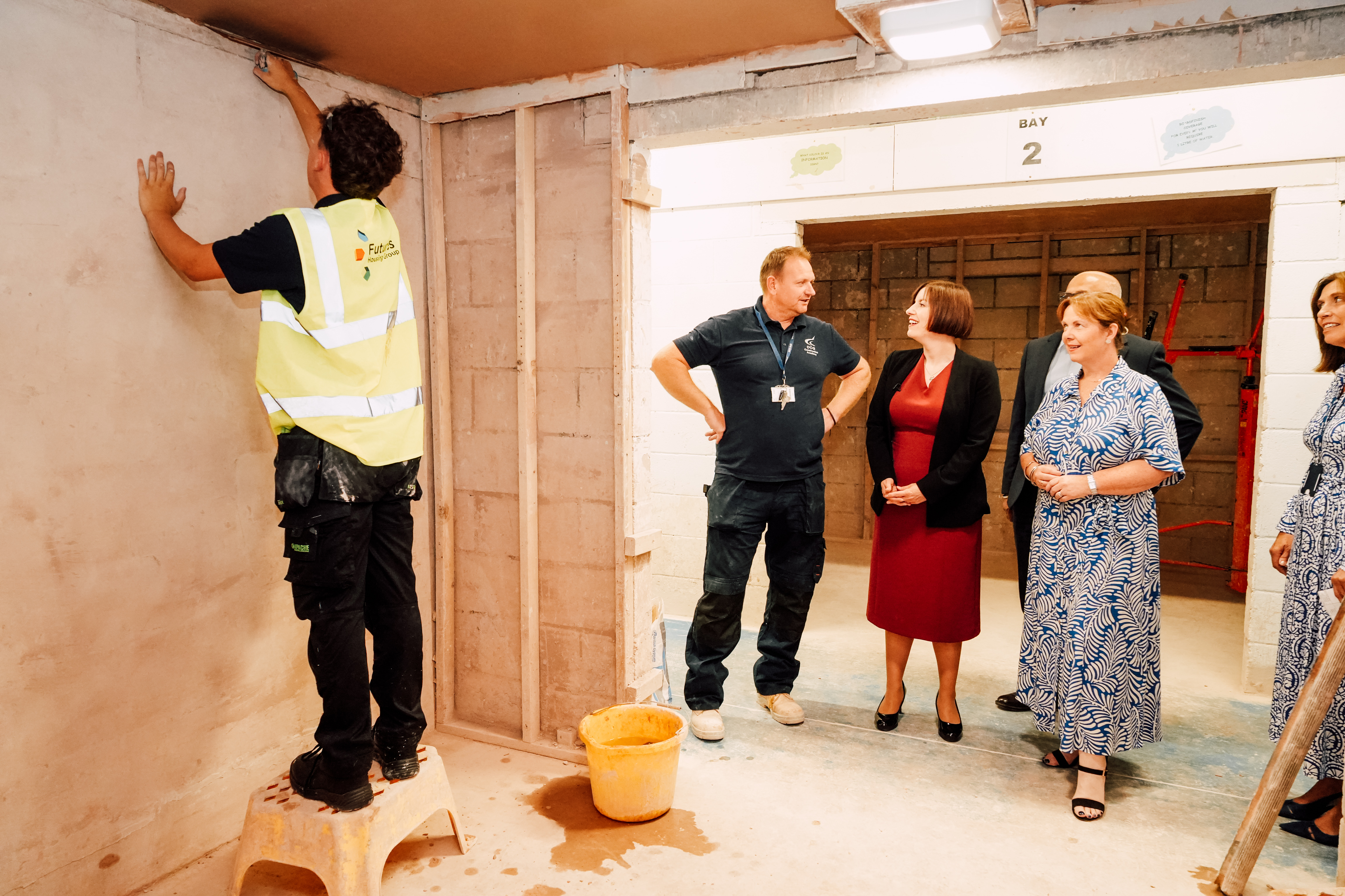 Futures colleague plastering a ceiling