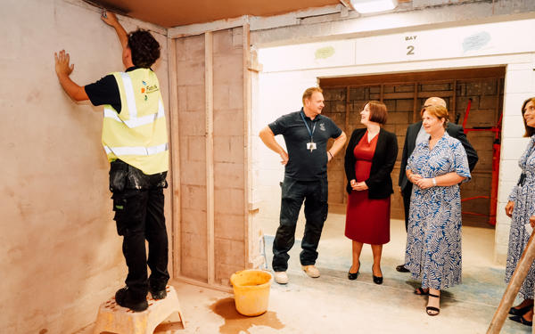Futures colleague plastering a ceiling