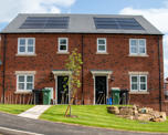 Two semi detached houses with solar panels on