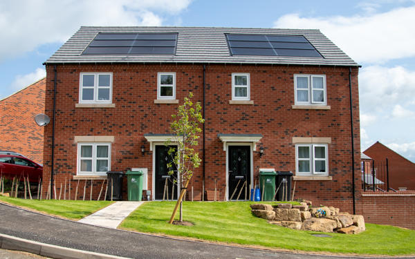 Two semi detached houses with solar panels on